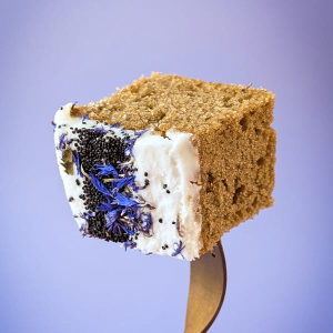 Chai Vanilla Traycake slice showing clean pre-cut edges, illustrating how to slice frozen cakes before serving.